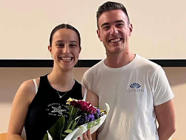 Christian Vari with Giorgia Cardinali, winner of Premio Codezen 2025, holding flowers at the ceremony